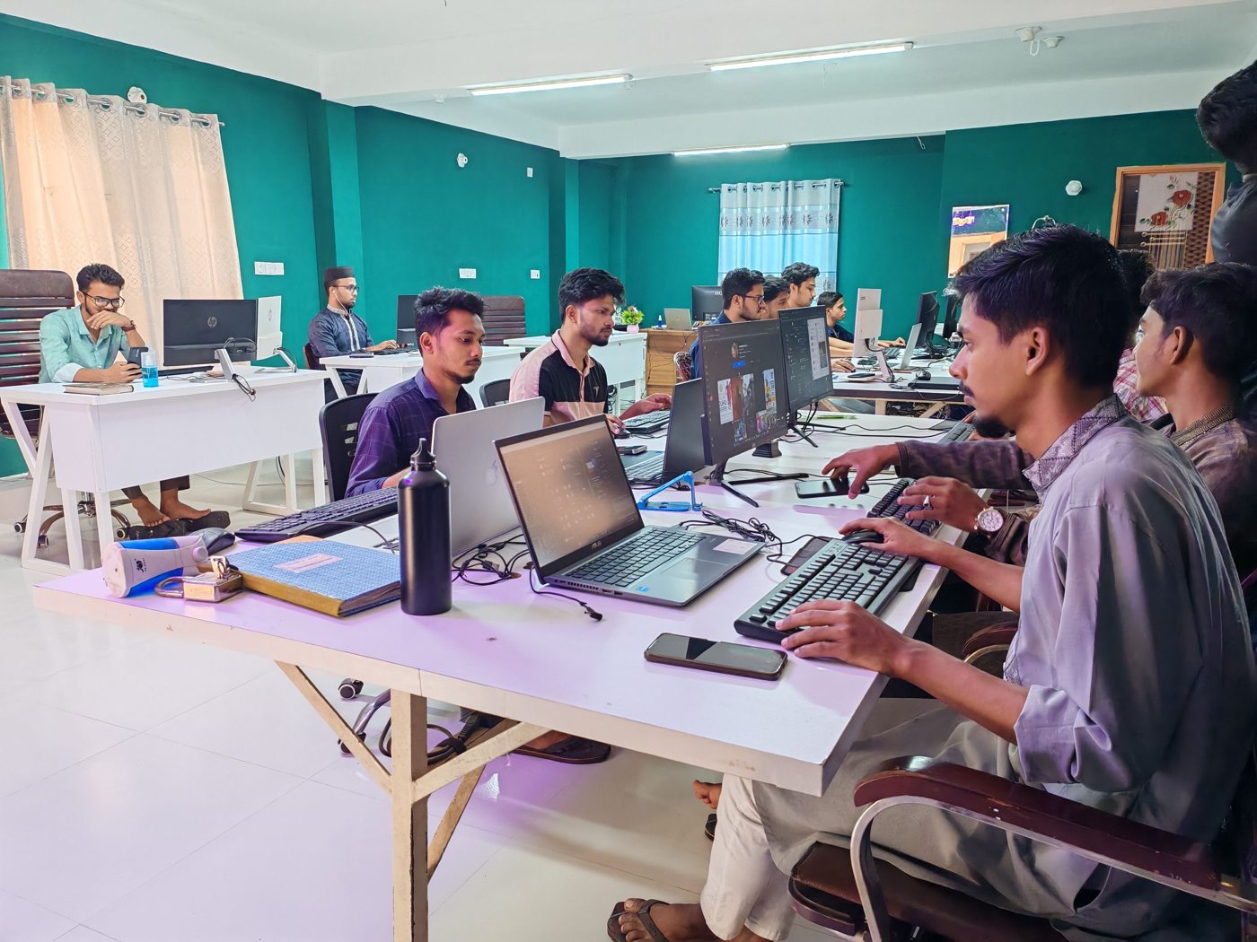 Professionals at computer workstations
